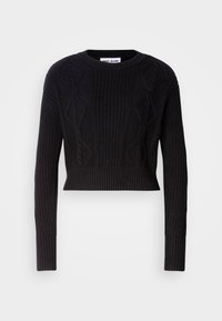 Svart kortad tröja gjord av ribbat stickat tyg, med texturerade kabelmönster, långa ärmar och rund halsringning.