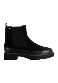 Bottines noires en daim avec des panneaux latéraux élastiques côtelés, semelle plate en caoutchouc et une petite languette au niveau du talon. Comprend des accents en cuir lisse.