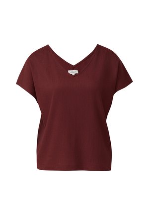 Blouse à manches courtes ribée bordeaux avec col en V, coupe ample et petite étiquette de marque au niveau de l'encolure.