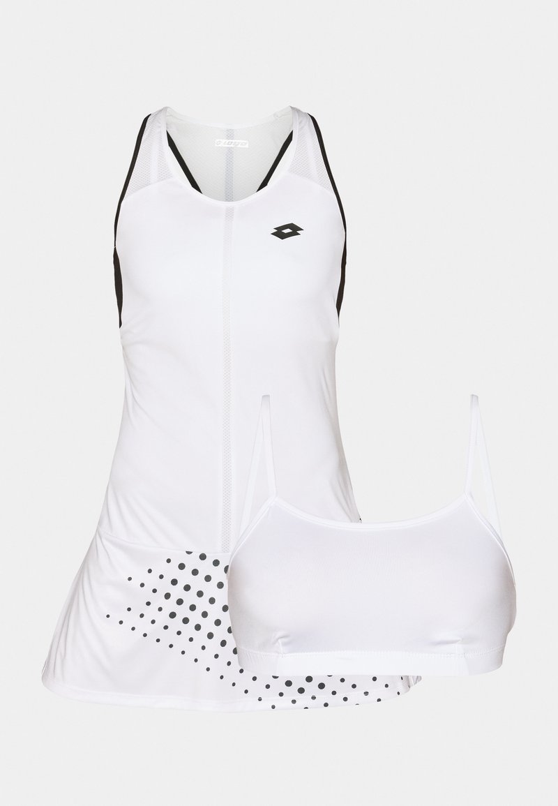 Robe de sport blanche avec des accents noirs, des panneaux en maille et un motif à pois en bas. Comprend un soutien-gorge de sport blanc assorti.