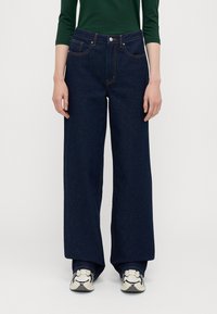 ONLY Tall ONLJUICY WIDE RINSE  - Wide leg - dark blue denim