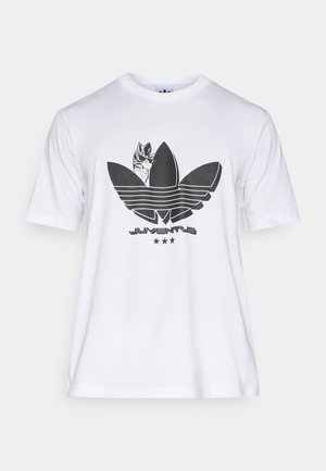 T-shirt en coton blanc avec un grand motif graphique noir représentant une plante stylisée et une tête de zèbre, avec le texte "JUVENTUS" en dessous.