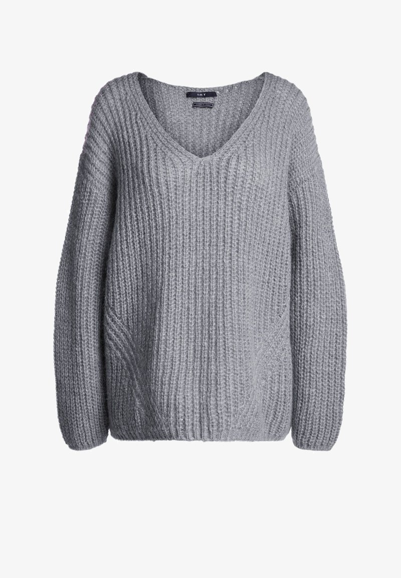 Pull gris en maille avec encolure en V, coupe oversize et motif côtelé texturé. Manches longues et silhouette décontractée, idéal pour superposer.