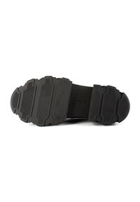 Black rubber shoe sole with a textured grip pattern, featuring multiple horizontal grooves and a rounded toe.