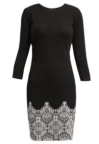 Robe noire longueur genou avec manches trois-quarts et motif blanc complexe le long de l'ourlet.