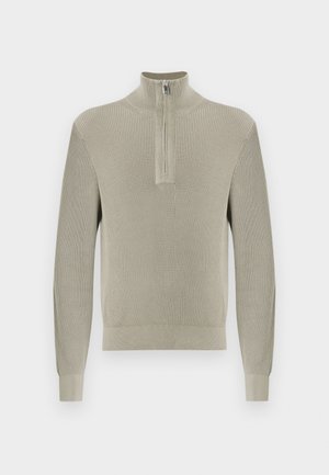 Lichtgrijze geribbelde pullover met een halve ritssluiting bij de kraag. Lange mouwen met aangesloten manchetten, gemaakt van een getextureerde gebreide stof.