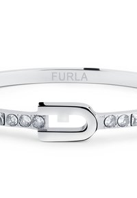 Hõbedane käevõru, millel on peen disain keskse aktsendiga ja viis väikest selget vääriskivi, mis on kinnitatud ühele küljele. "Furla" on graveeritud sisse.