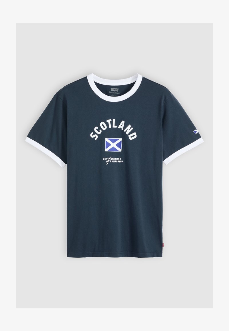 Navy blue T-shirt with white trim, "SCOTLAND" text, Scottish flag graphic, and "Levi Strauss California" logo on the front and sleeve.