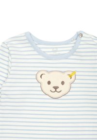Tutina in cotone a righe blu e bianche con scollatura rotonda e applicazione di faccina d'orso in crema e marrone, con un dettaglio giallo.