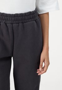 Rip Curl VARSITY PANTS - Trainingsbroek - washed black