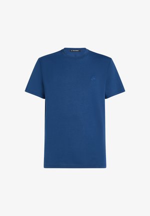 Zils apļa kakla T-kreklis, kas izgatavots no gludas kokvilnas auduma, ar īsām piedurknēm un smalku izšūtu logotipu uz krūtīm.