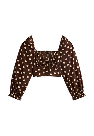 Bruine crop top met stippen, lange pofmouwen, vierkante halslijn en geplooid detail op het lijfje. De stof is glad met een subtiele glans.
