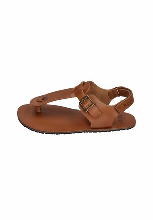 Brown leather sandal with a toe loop, adjustable buckle strap, and flat black sole, viewed from the side against a white background.