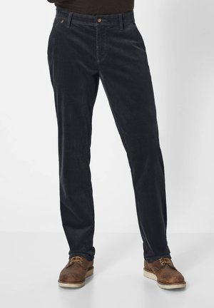 Dark blue corduroy pants with a straight fit, button closure, and subtle side accents; paired with brown leather shoes.