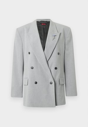 Hall hall kahe rinnaosaga bleiser mustade nuppudega, vormitud lõikega, sälguga krae ja vasakul pool dekoratiivne pross.