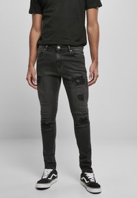 Urban Classics - HEAVY DESTROYED SLIM FIT JEANS - Pieguloša piegriezuma džinsi - realblk heavy destroyed washed Miniatūras attēls 1