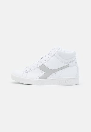 High-top sneakers made of white leather with gray accents. Features a round toe, lace-up design, and a textured, padded collar.