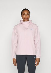 Light pink windbreaker jacket with a zip front, adjustable hood, and elastic cuffs. Features a subtle logo on the chest.