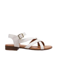 Sandale en cuir blanc avec un design à bout ouvert, des brides entrecroisées, une boucle réglable au niveau de la cheville et un petit talon en bois marron.