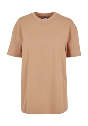 T-shirt in cotone beige con una vestibilità comoda, maniche corte e scollatura rotonda, caratterizzata da una texture liscia e dettagli di cucitura minimi.