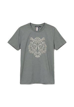 T-shirt grigio con scollo a girocollo e maniche corte, con grafica dettagliata del volto di una tigre bianca al centro della parte anteriore.