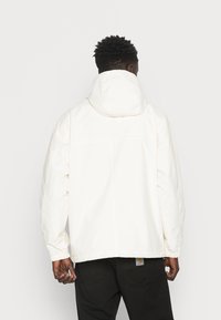 Carhartt WIP Corta-vento - beige