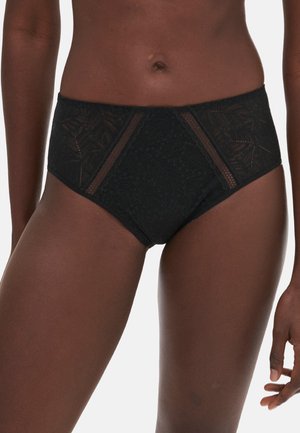 Culotte nere a vita alta realizzate in pizzo e rete, con motivi floreali e pannelli laterali trasparenti, che offrono un dettaglio tessurizzato.