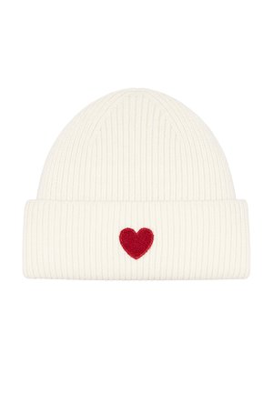 White knit beanie with ribbed texture and a folded cuff, featuring a small red heart embroidered on the front.