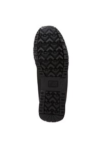 Black rubber shoe sole with deep, multidirectional tread pattern and central logo for traction and grip.
