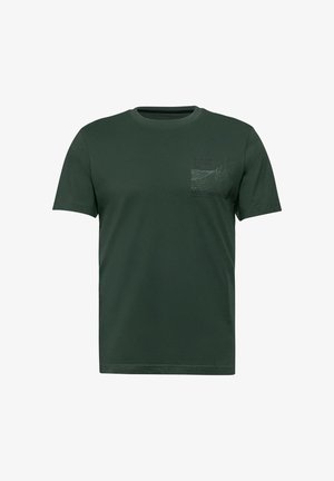 T-shirt en coton à manches courtes vert foncé avec un graphique de poche sur le devant, comportant du texte et un motif de vagues sur le côté gauche. Encolure ronde.