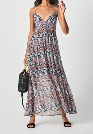 Robe maxi à bretelles spaghetti, avec un col en V, motif abstrait coloré en rose, bleu et noir ; tissu léger et fluide.