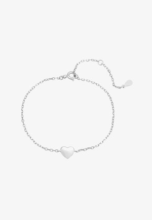 Pulsera de plata con una delicada cadena y un charm central en forma de corazón. La cadena tiene un cierre de langosta y un extensor ajustable.