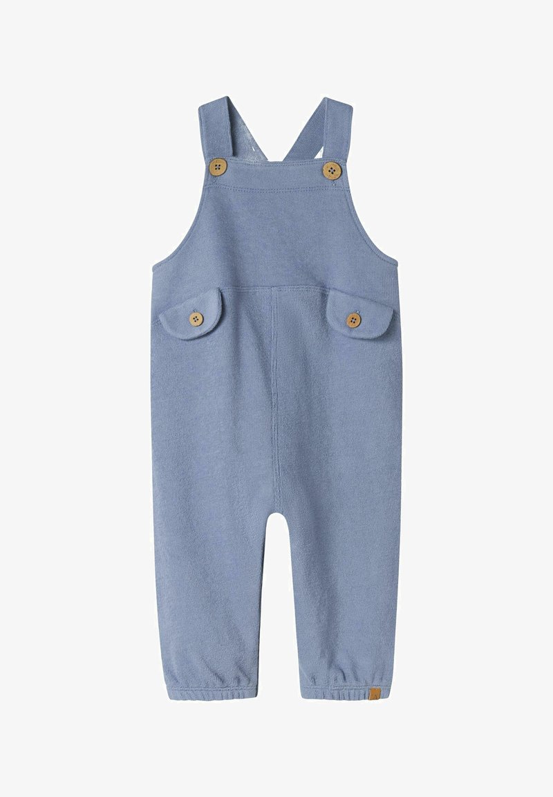 Modri pleteni kombinezon z nastavljivimi trakovi, dvema sprednjima žepoma z zaobljenimi pokrovi in lesnimi gumbi. Elastični konci na gležnjih.