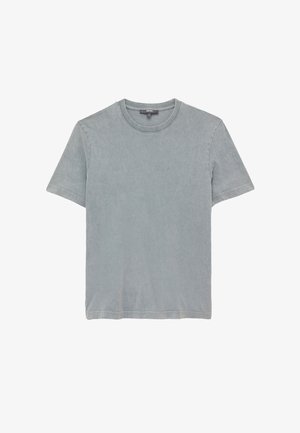 Vaaleanharmaa puuvillapaita, jossa on pyöreä kaula-aukko, lyhyet hihat ja pehmeä, hieman teksturoitu pinta. Ominaisuuksiin kuuluu suora helma ja minimivärjäys.