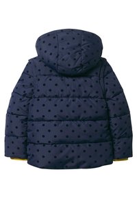 Navy puffer jacket with a hood, featuring black polka dots. Horizontal quilted design and yellow trim at the cuffs. Soft texture.