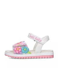 Sandali bianchi con ricami floreali colorati, una striscia in velcro e una suola rosa con punti arrotondati. Nome del marchio "Lelli Kelly" sulla striscia.