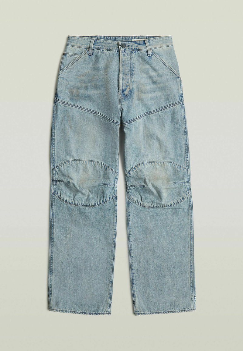 Pantaloni in denim azzurro chiaro con toppa rinforzata sulle ginocchia, gambe dritte, chiusura frontale con cerniera e bottone, e tasche frontali inclinate.