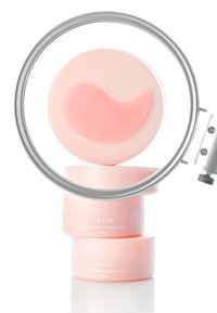 Boîte circulaire rose contenant des patchs oculaires Abib PDRN retinal, affichant un patch en forme de cœur à l'intérieur. Surface lisse avec des accents texturés.