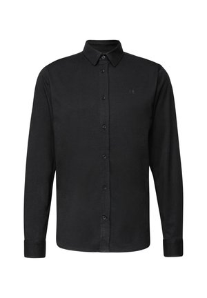 Musta pitkähihaista nappipaitaa. Siinä on klassinen kaulus, etupainike suljenta ja hienovarainen logo rintataskussa. Silkkinen pinta.