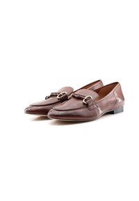 Brown leather loafers with a flat heel, featuring a decorative buckle and smooth finish. Rounded toe shape with stitching detail along the edges.