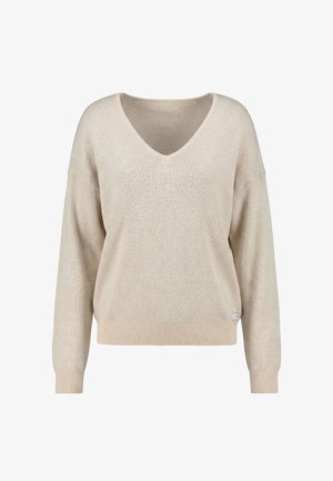 Pulover bej cu decolteu în V, mâneci lungi și manșete și tiv striate, prezentat pe un fundal alb simplu.