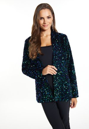 Paillettenjacke in dunklen Blau- und Grüntönen, mit lockerer Passform und offenem Design. Der Stoff hat eine strukturierte, glänzende Oberfläche.