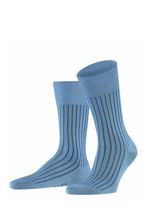 Light blue socks with a ribbed design, featuring darker blue vertical stripes. Made of soft material with reinforced heel and toe sections.