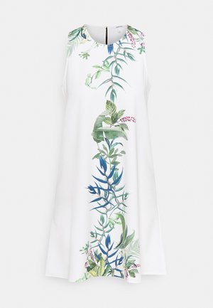 Robe blanche sans manches avec un col rond présentant un imprimé botanique vertical de feuilles vertes et bleues et de petites fleurs roses au centre.