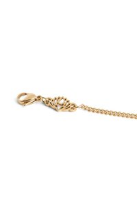 Gold chain bracelet featuring a lotus flower design and a lobster claw clasp, highlighted by a textured, interlinked chain.