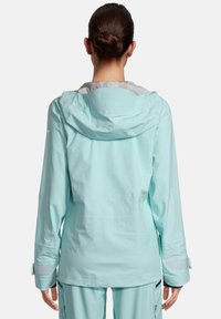 Light blue waterproof jacket with a hood, featuring long sleeves, adjustable cuffs, and a smooth exterior. Back view displayed.