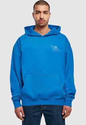 Felpa blu in cotone, con tasca frontale e una grafica di una ragnatela bianca sul lato sinistro del petto. Design casual con cappuccio.