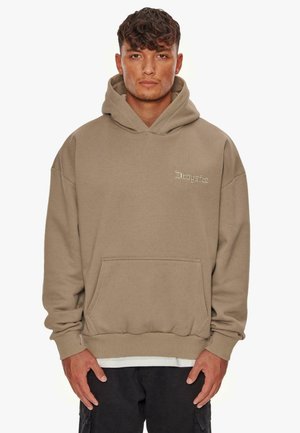 Beige hoodie van zacht materiaal, met een kangoeroezak, een capuchon met trekkoord en een discreet logo in de bovenste linkerhoek.