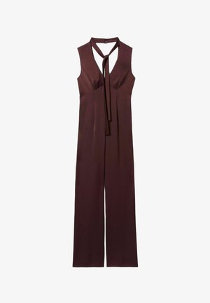 Jumpsuit senza maniche marrone con scollatura profonda a V e dettaglio con fiocco al collo. Gambe a svasare e texture liscia creano una silhouette aderente.