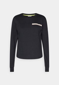 Black long-sleeve shirt with round neckline. Features a contrasting beige pocket with button details and a green accent on the inner collar.